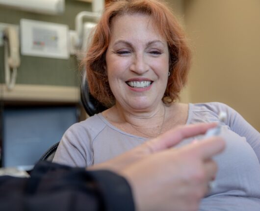 Patient smiling on the dental chair