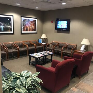 The waiting area with T.V. mount on the wall of the dentistry