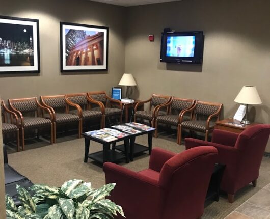 The waiting area with T.V. mount on the wall of the dentistry