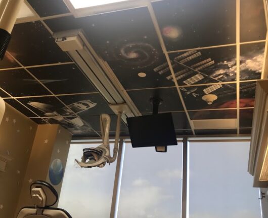 Dental treatment room with animated images printed on the ceiling